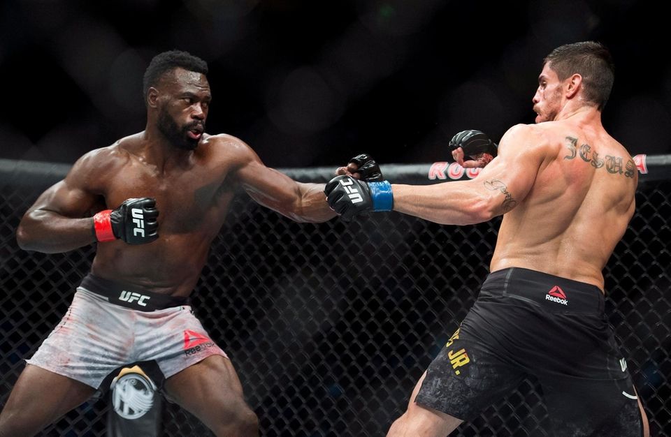 Middleweight fighters Uriah Hall, left, fights Antonio Carlos