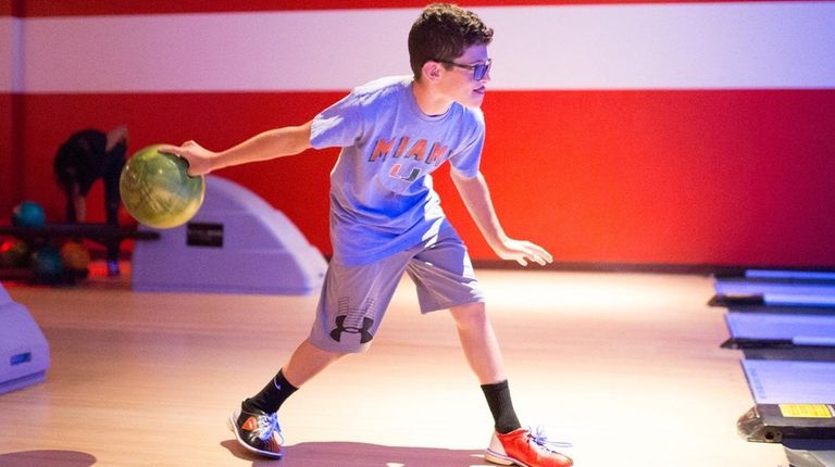 Seth Popkin of Plainview, 13, bowls at Bowlmor
