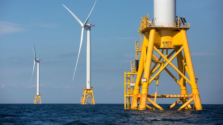 Three of Deepwater Wind's turbines stand in the