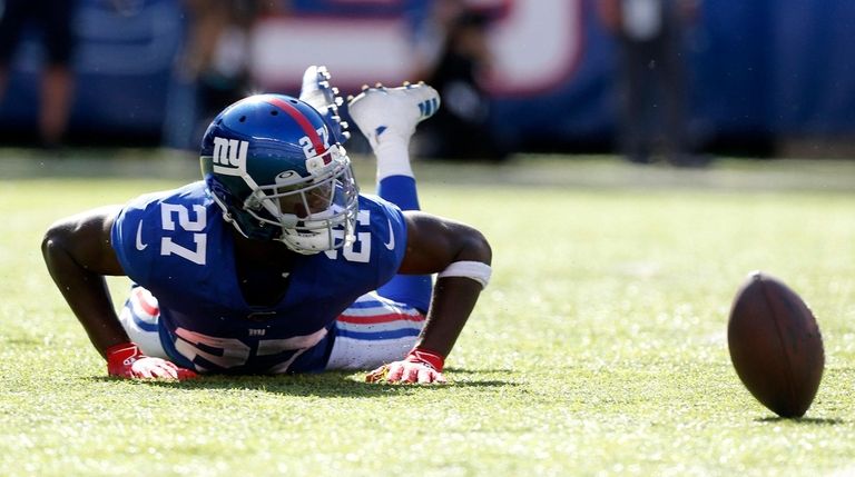 Deandre Baker of the Giants looks on after