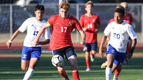 Smithtown East's Noah Lavrenchik dribbles the ball upfield