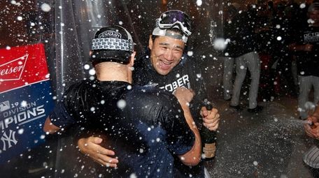 Masahiro Tanaka #19 of the Yankees celebrates in