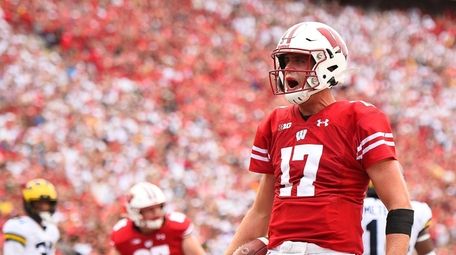 Jack Coan of the Wisconsin Badgers celebrates after