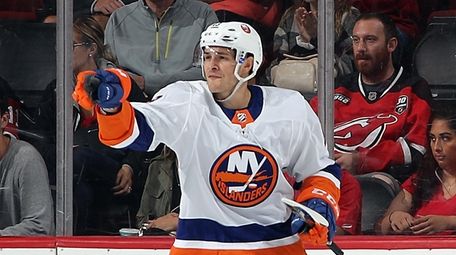 Mathew Barzal #13 of the Islanders celebrates his