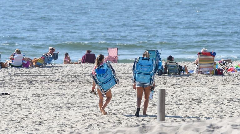 Two women head to the beach at Gilgo
