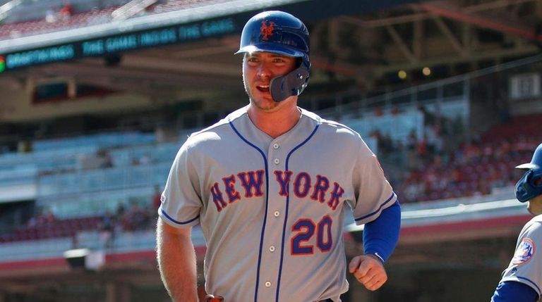 The Mets' Pete Alonso wears a smiles as