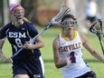 Sayville's Madison Hoon is defended by Eastport-South Manor's