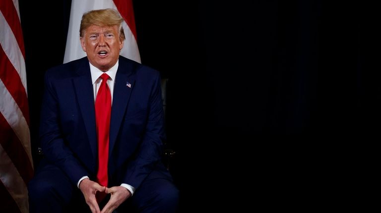 President Donald Trump speaks during a meeting with