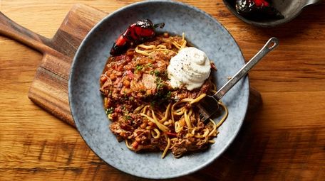 Spicy pork ragu over bucatini at Rustic Root