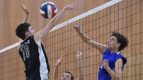 Cooper Moran #10 of Bellmore JFK, left, looks