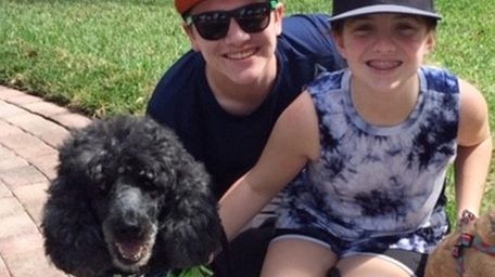 Kevin Scott Stubing, center, and Madeline Emma Stubing,