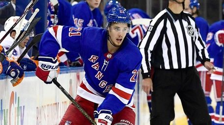 Brett Howden of the Rangers carries the puck