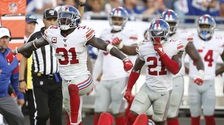Safety Michael Thomas of the Giants celebrates after