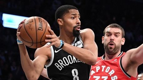 Nets guard Spencer Dinwiddie passes the ball from