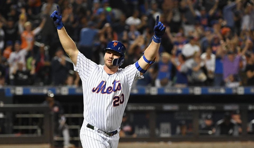 Mets' Pete Alonso reacts after he hits his