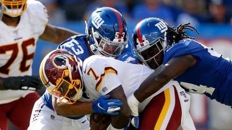 Markus Golden and Oshane Ximines of the Giants