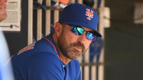 Mets manager Mickey Callaway looks on from the