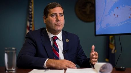 Suffolk County District Attorney Timothy Sini, speaks at