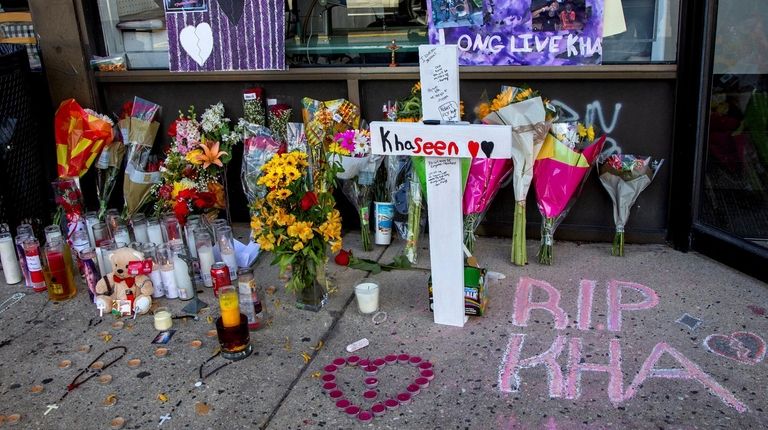 Candles and flowers are left at the scene