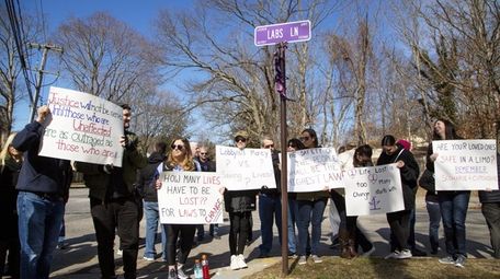 The families of the four victims killed in
