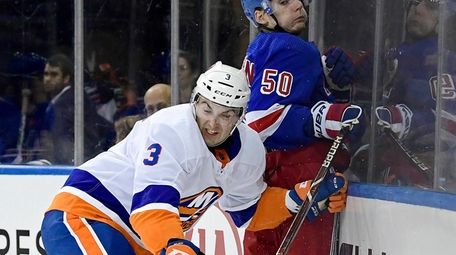 Lias Andersson #50 of the Rangers is checked