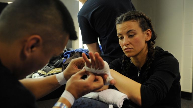 Miesha Tate gets her hands wrapped for her