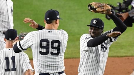 Yankees' Aaron Judge and Didi Gregorius, right, celebrate