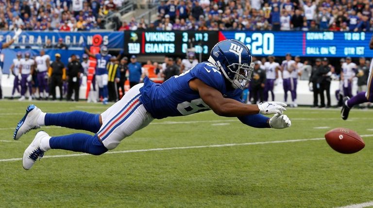 Sterling Shepard of the Giants dives for an