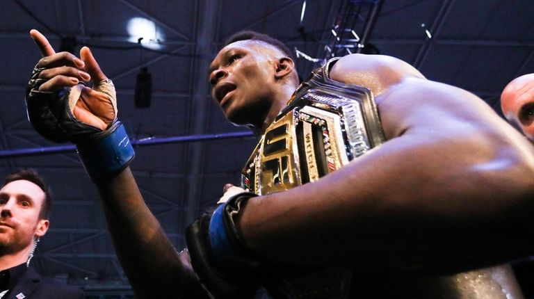 Israel Adesanya of New Zealand celebrates after defeating