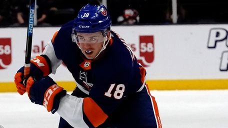 Islanders left wing Anthony Beauvillier skates to the
