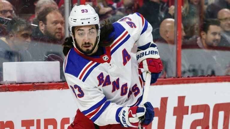 Mika Zibanejad of the Rangers passes the puck