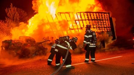 Firefighters battle a truck fire on eastbound Sunrise