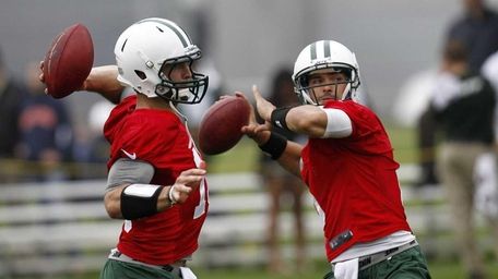 Tim Tebow and Mark Sanchez work out at