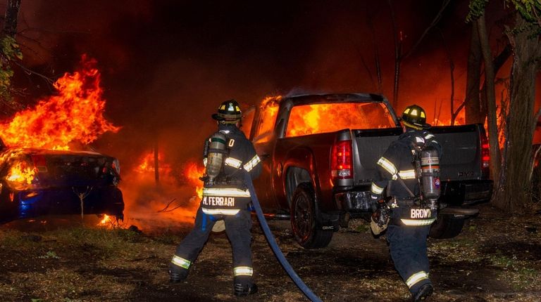 A fire damaged 25 vehicles at an auto