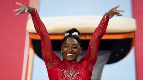 Simone Biles of USA reacts in the Vault