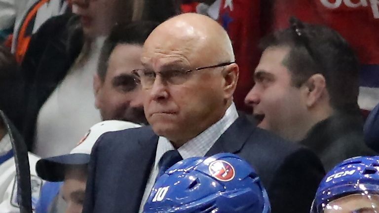 Islanders head coach Barry Trotz watches from the