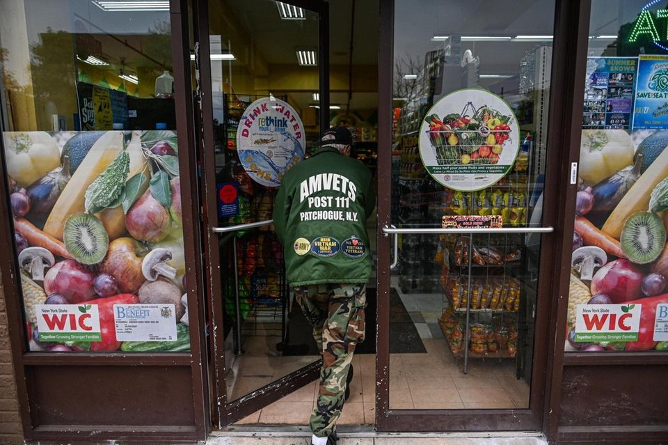 A man walks into the Bravo supermarket in
