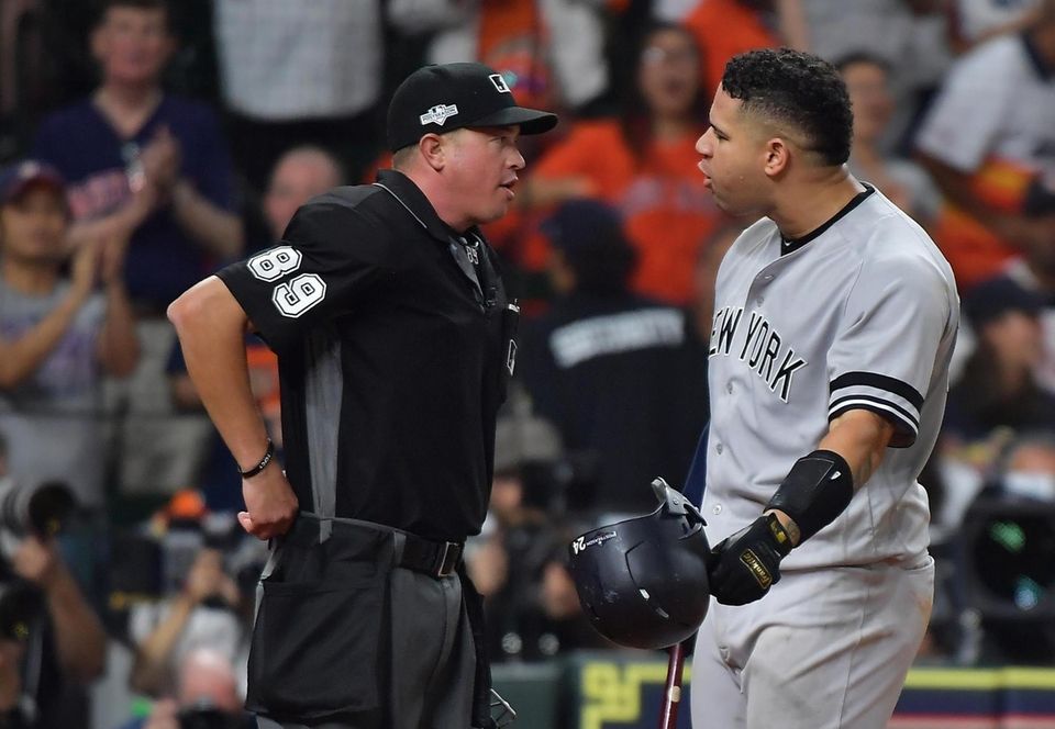 Yankees catcher Gary Sanchez (24) argues the strike