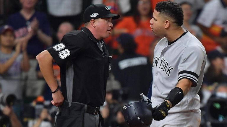 Yankees catcher Gary Sanchez (24) argues the strike