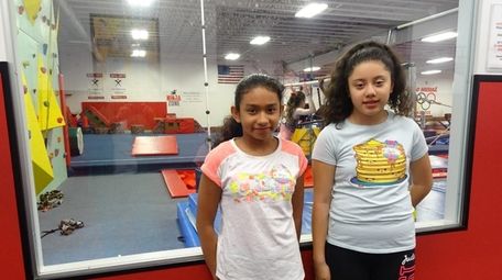 Kidsday reporters Ferguie Guardado,left, and Jaylie Polanco,at Gold