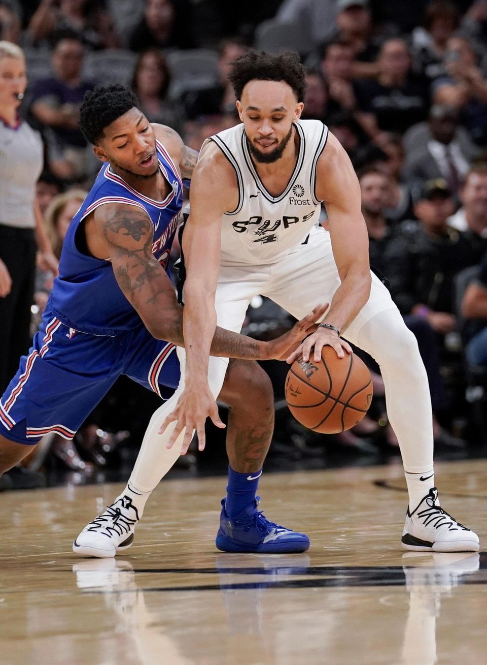 The San Antonio Spurs' Derrick White, right, is