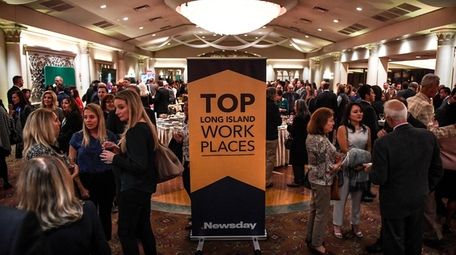 Attendees mingle during the cocktail hour before last