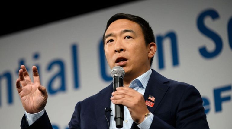 Andrew Yang speaks during a forum on gun