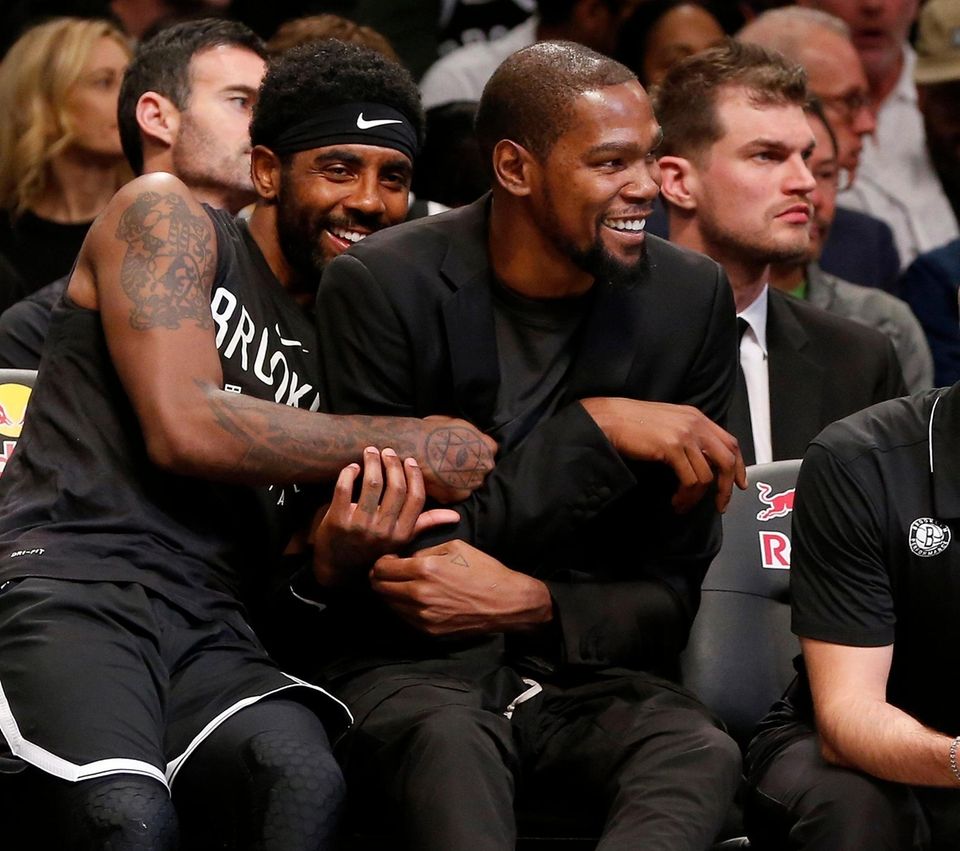 Kyrie Irving #11 and Kevin Durant #7 of