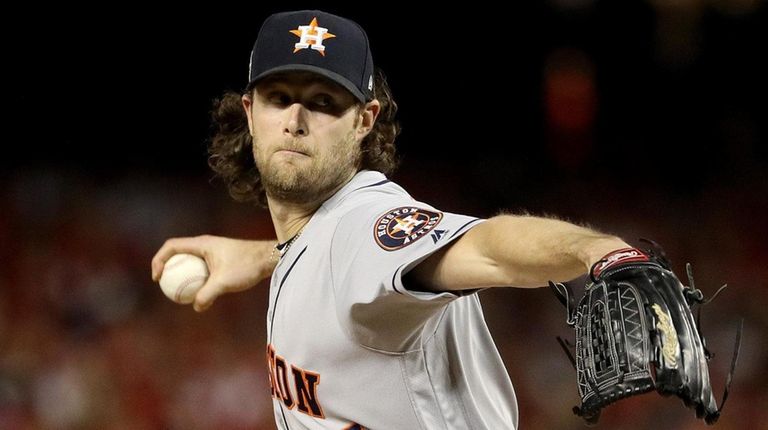 Gerrit Cole of the Astros delivers the pitch
