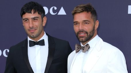 Jwan Yosef, left, and Ricky Martin attend the