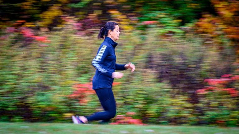 NIcole Henn of Syosset runs trails Wednesday to