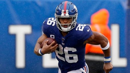 Saquon Barkley of the Giants runs the ball