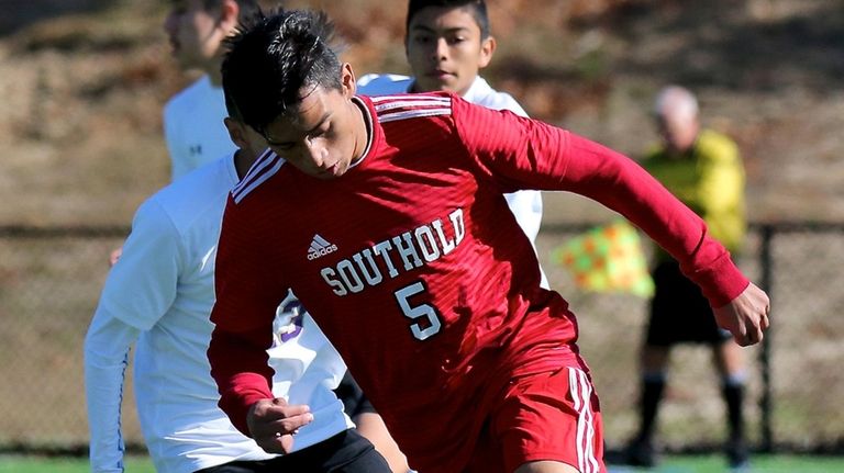 Southold midfielder Daniel Palencia moves the ball through