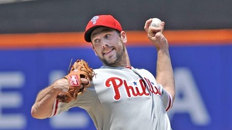 Cliff Lee delivers to the plate during a